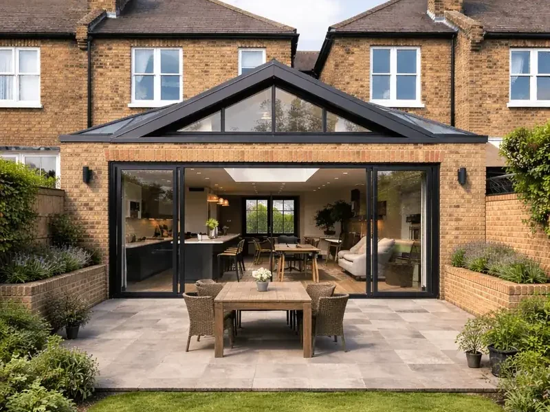 Completed rear house extension with glazed gable and sliding doors
